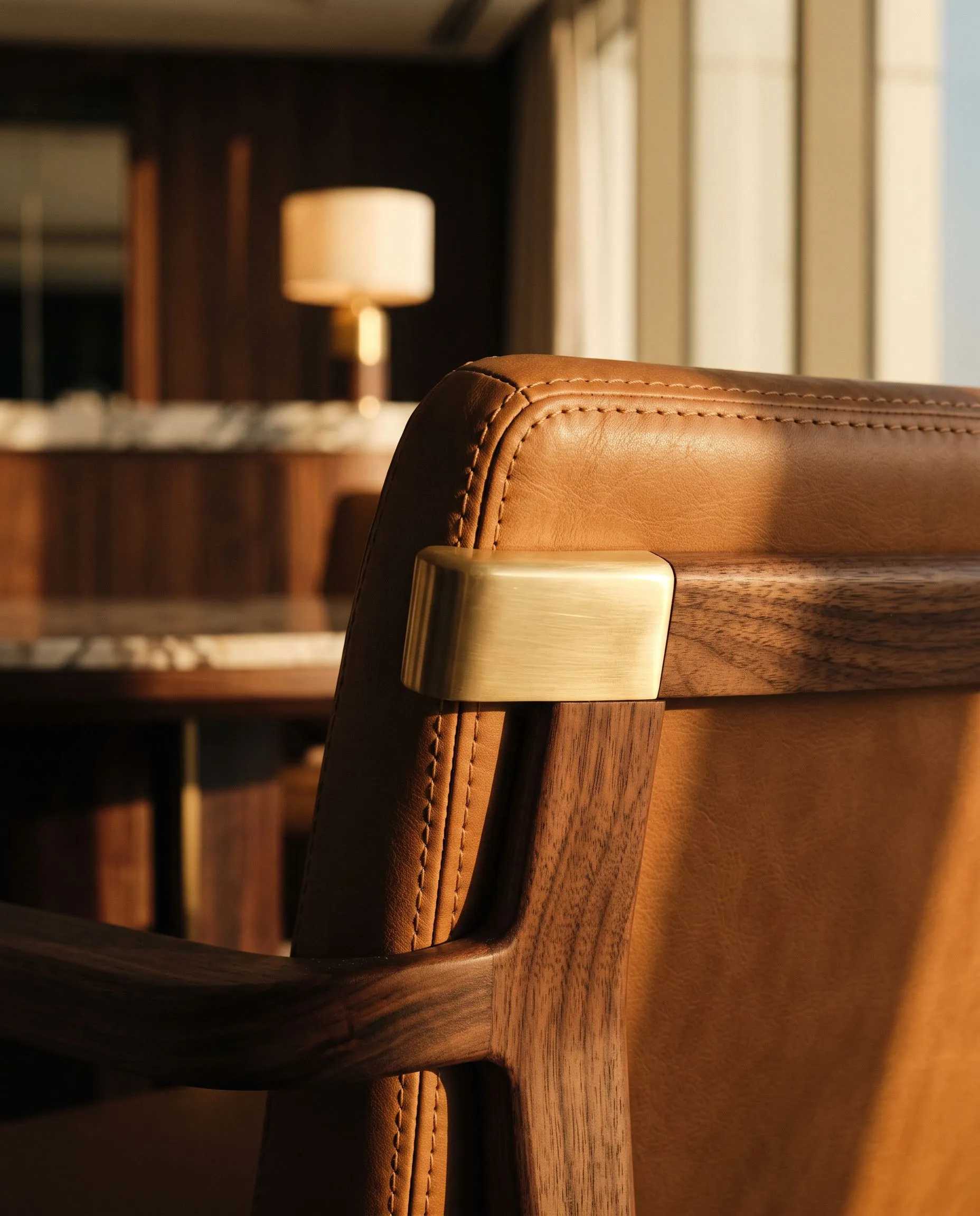 Craft detail: hand-stitched leather and brass in an elegant Dubai interior